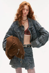 Distressed denim jacket and short skirt