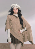 british muse cloak, knit sweater cloak, cable knit cape, french knit shawl, winter knitted cape women, twist knit cloak top, elegant knit outerwear, korean style knit cape, autumn winter knitwear, oversized knit shawl, chic cloak sweater, warm cable knit top, french luxury knitwear, nom alm style knit, womens winter fashion 2025