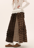 brown plaid skirt, layered midi skirt, patchwork check skirt, ruffle plaid skirt, autumn winter outfit women, mocha mid length skirt, fw25 collection, street boutique fashion, korean plaid fashion, tokyo style skirt
